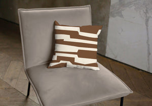 Brown pillow with labyrinth pattern