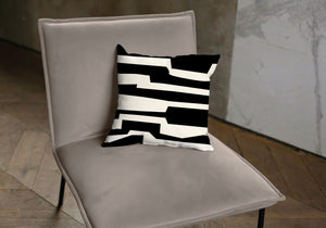 Black and white pillow with labyrinth pattern